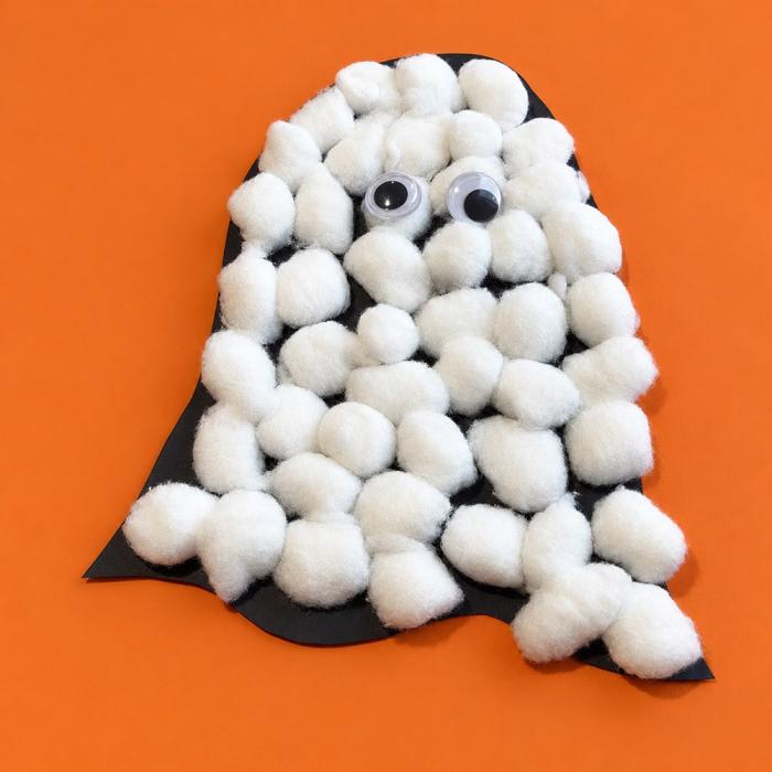 Cotton balls glued onto a piece of construction paper cut into the shape of a ghost
