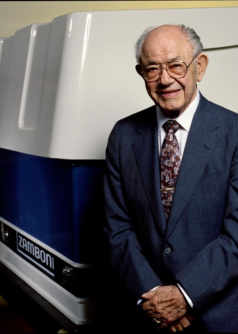 Frank J. Zamboni beside his famous ice resurfacing machine