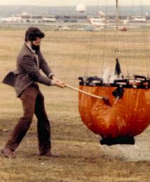 Don Arney hitting a Bambi Bucket with an ax