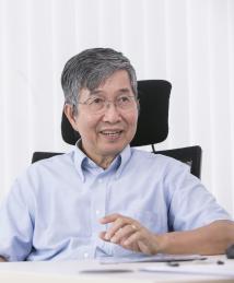 Ching Wan Tang sitting at desk