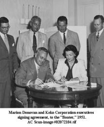 Marion Donovan signing with executives 