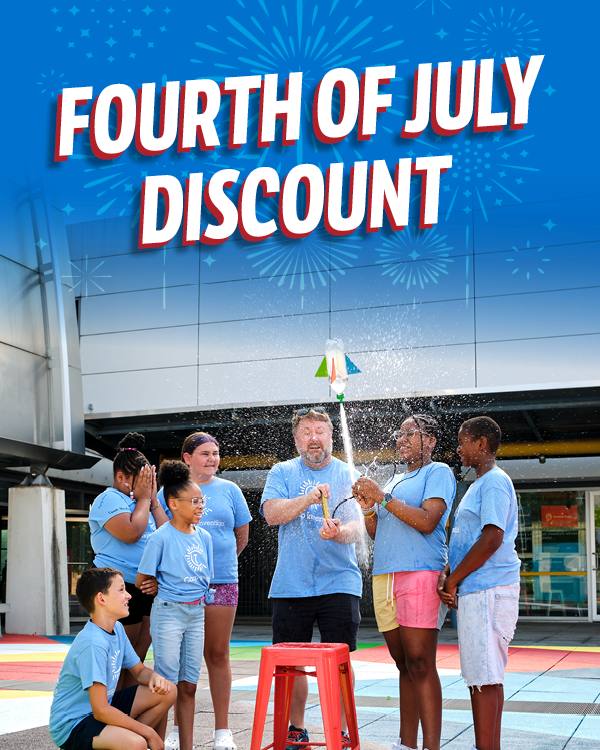 A Camp Invention Instructor helps elementary students launch a bottle rocket under fireworks and “Fourth of July discount”