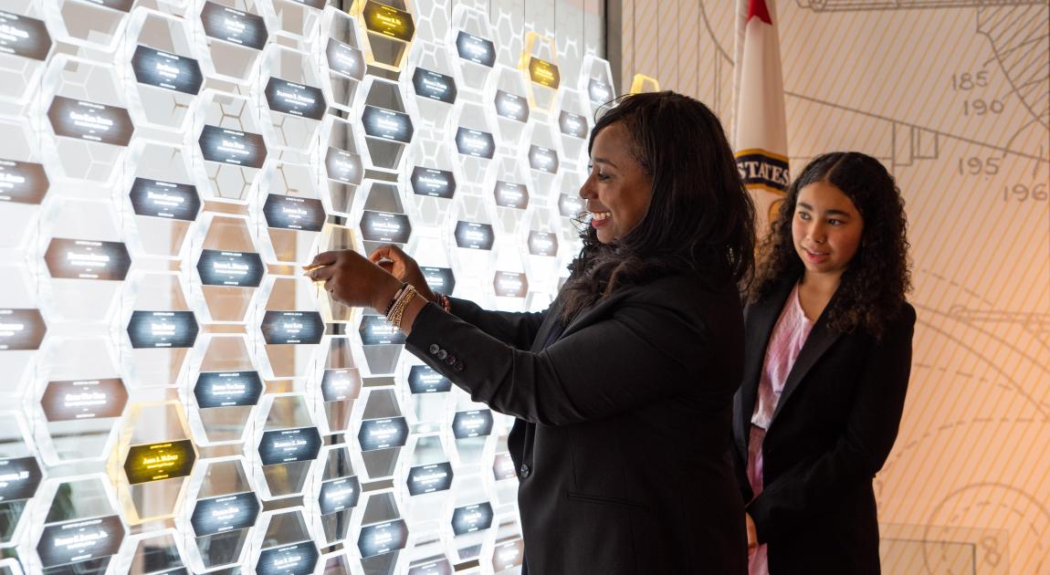Eraka Bath placing Patricia Baths nameplate at the Illumination Ceremony