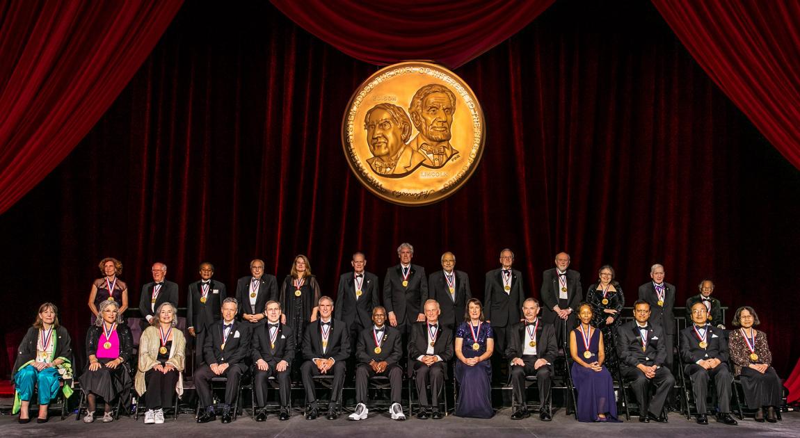 The 2022 National Inventors Hall of Fame® Inductee class poses together for a group photo after the Induction Ceremony