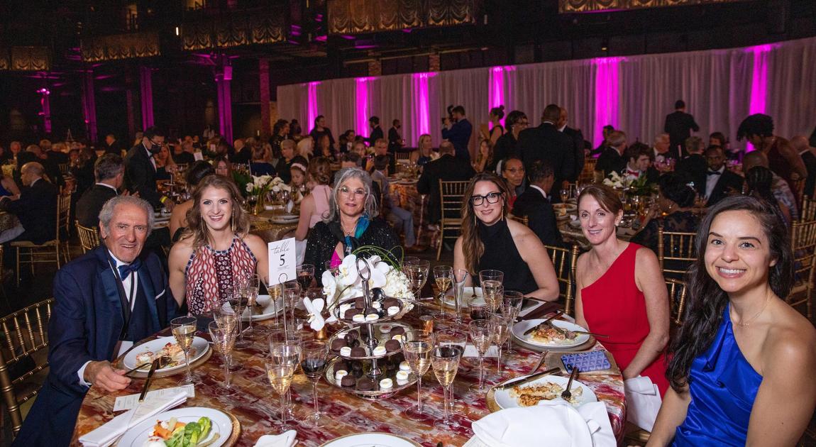 National Inventors Hall of Fame® Inductees and sponsors sit together during the Induction Ceremony dinner