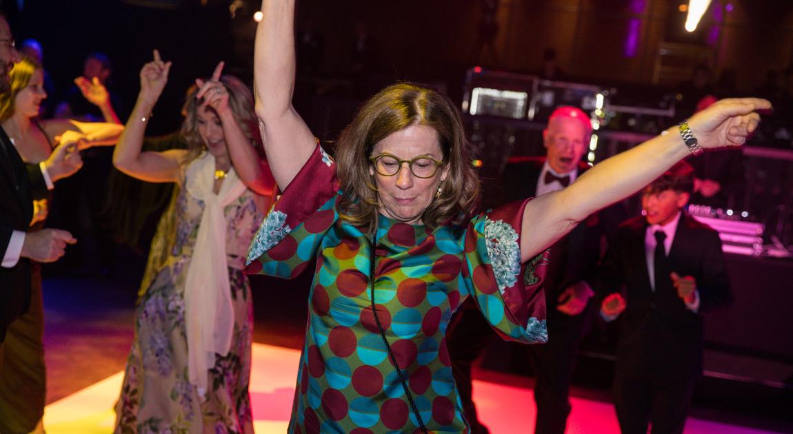 Event attendees dance during the celebration held after the Induction Ceremony ends