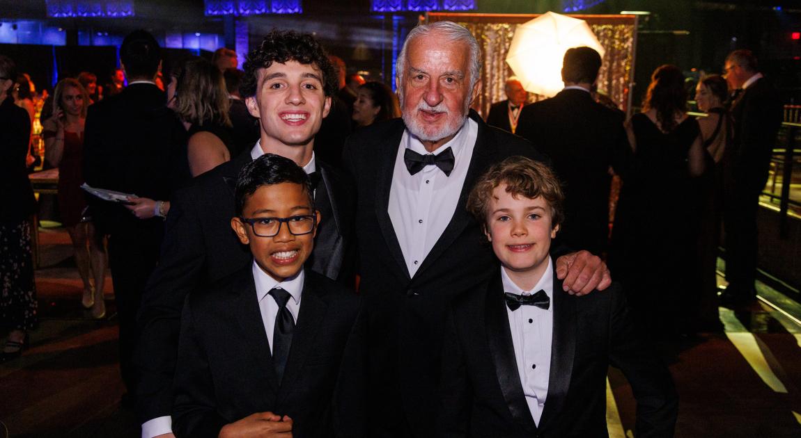 Hall of Famer Louis Argenta smiles with his grandchildren