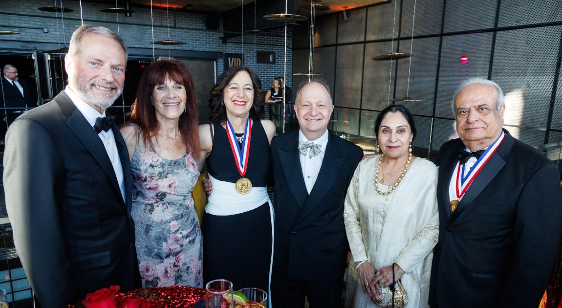 Hall of Famers Henry Samueli, Andrea Goldsmith and Asad Madni celebrate before the Induction Ceremony